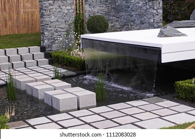 A Modern Water Garden With Stepping Stones Making A Impressive Feature