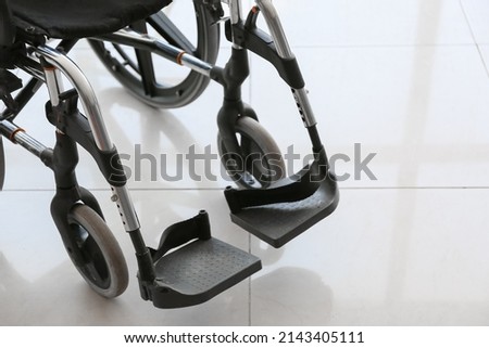 Similar – Senior woman in a wheelchair alone