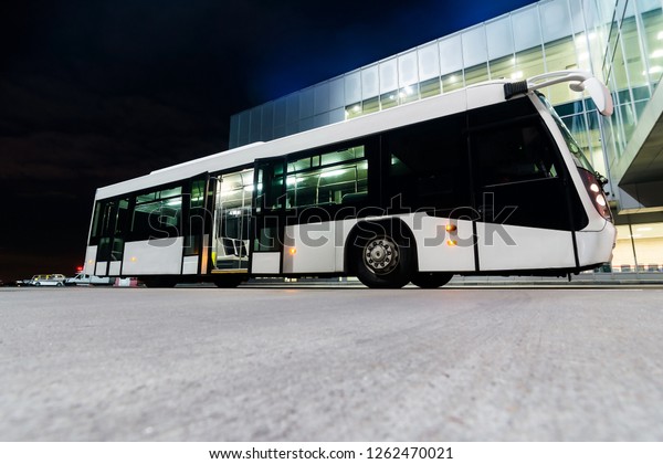 Modern\
white airport bus for passengers. View from the ground. Travel\
concept - St. Petersburg, Russia on 3 dec.\
2018