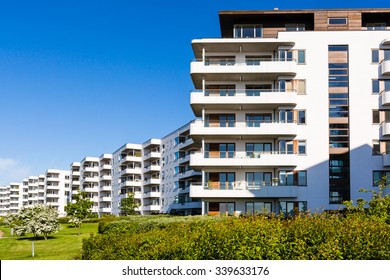 Modern white danish residential condominium building near Copenhagen, Denmark on a sunny day.