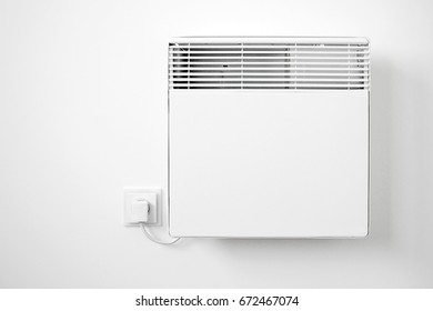 Modern White Electric Radiator On The Wall