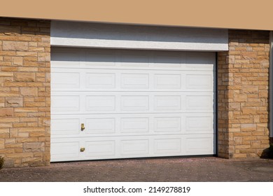 Modern white garage door (sectional door) - Shutterstock ID 2149278819