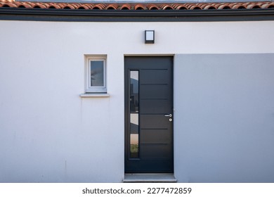 modern white house with grey facade door of suburb home entrance - Shutterstock ID 2277472859
