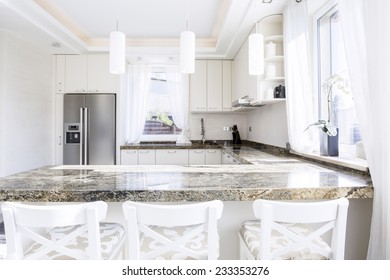 Modern, White Kitchen With Long Granite Worktop