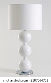 Modern White Lamp With Balls Design And A Straight Lamp Shade, Isolated On White