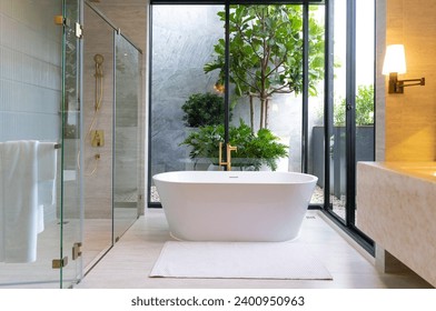 Modern White Marble Bathroom Design with Freestanding Bathtub. Bathroom with double sinks and shower room. - Powered by Shutterstock