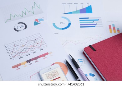Modern white office desk table with smartphone and other supplies with Business report meeting and briefing.