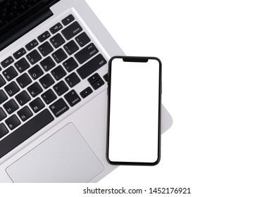 Modern white office work table with smartphone mock up laptop ,top view
