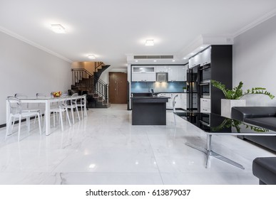 Modern, White, Open Plan Apartment With Gloss Flooring, Table, Kitchen And Staircase