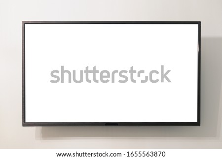 Modern widescreen TV set with blank screen hanging on the wall.