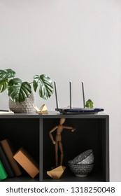 Modern Wi-fi Router On Dark Shelf