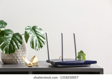 Modern Wi-fi Router On Dark Table