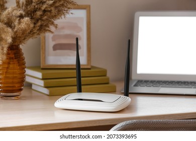 Modern Wi-fi Router On Table In Room