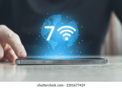 Modern Wi-Fi technology version 7. High-speed wireless Internet. Person clicks on smartphone. - Shutterstock ID 2201677419