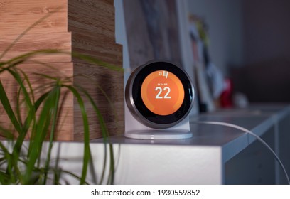 A Modern Wifi Thermostat In A Cozy Home In Soft Evening Light