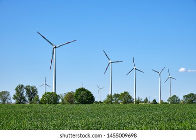 Modern wind wheels seen in a rural area in Germany