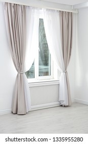 Modern window with curtains in room. Home interior - Shutterstock ID 1335955280