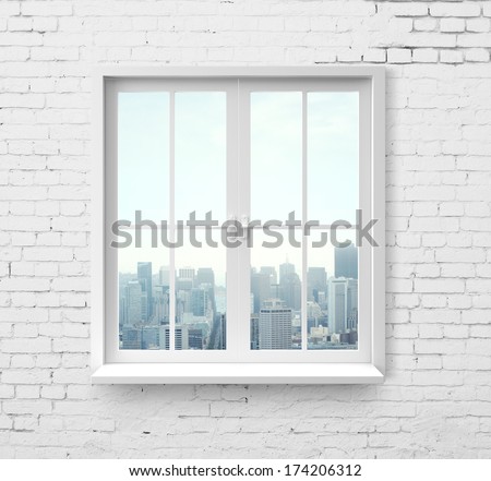 Modern window with skyscraper view in brick wall