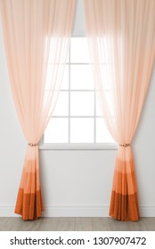 Modern window and stylish orange curtains indoors