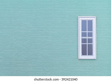 Modern Windows And Detail Of House Exterior Blue Wall.