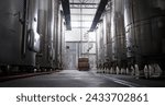 Modern winery interior with large metal tanks. Production and line of industrial chemical tanks in chemical pharmaceutical production