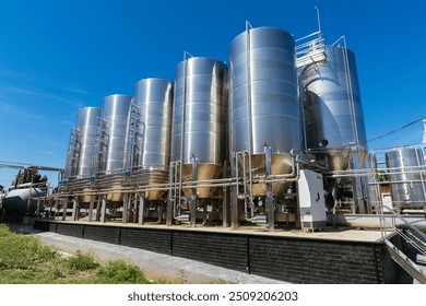 Modern winery production line. Large tanks for fermentation.