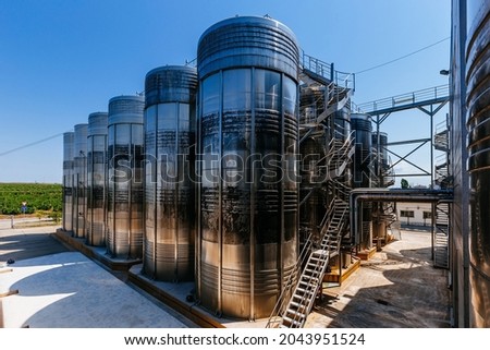 Modern winery production line. Large tanks for fermentation.