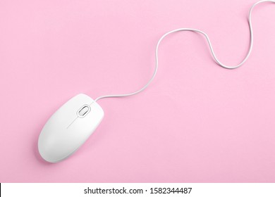 Modern Wired Optical Mouse On Pink Background, Top View