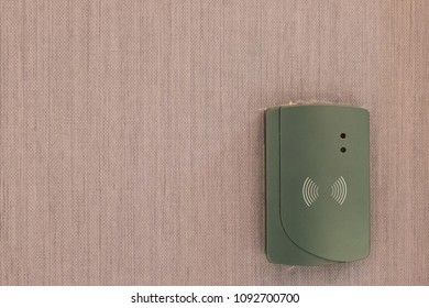 Modern Wireless ADSL Router On Wall. Ceiling Access Point WIFI. Wireless Router On Light Background In Hotel.