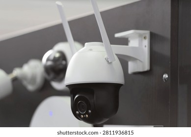 Modern wireless PTZ security camera with dual antennas for smart video surveillance, remote monitoring, property protection and AI-powered security systems in residential and commercial environments.