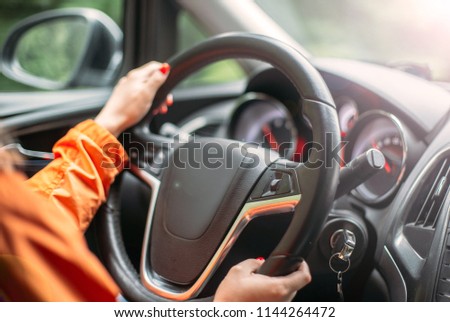 modern woman car driver. manicure.