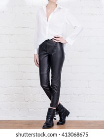 Modern Woman Outfit With White Shirt And Leather Pants