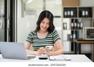 Modern woman typing and messagin with mobile phone. Women using cellphone app. Technology and computer workplace.