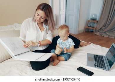 Modern Woman Working With Child. Multi-tasking, Freelance And Motherhood Concept