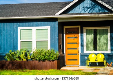 Modern Wood Door With Yellow Retro Glider On Patio Porch Real Estate Modern Homes Modern Day Living In Austin Texas Suburb Neighborhood