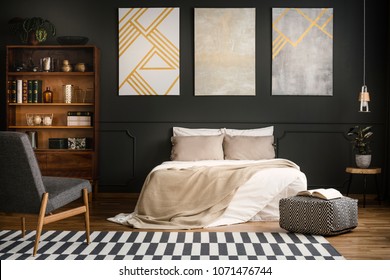 Modern Wooden Bedroom Interior With White Bed, Carpet, Bookcase And Armchair