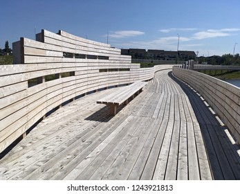 Modern Wooden Bridge Over A Storm Water Pond