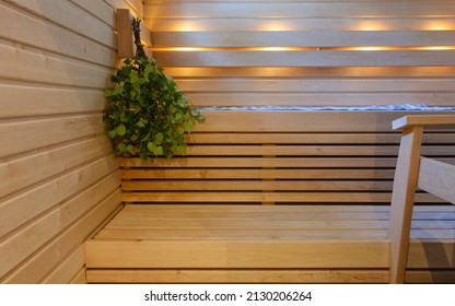 Modern Wooden Finnish Sauna Interior With Fresh Birch Whisk.