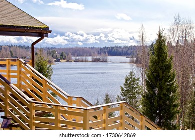 Modern Wooden Hilltop House With Panoramic Lake Views. Chalet On Top Of A Hill Among Fir Trees With Beautiful Views. Expensive Suburban Real Estate. Wooden Cottage In A Coniferous Forest By The Lake. 