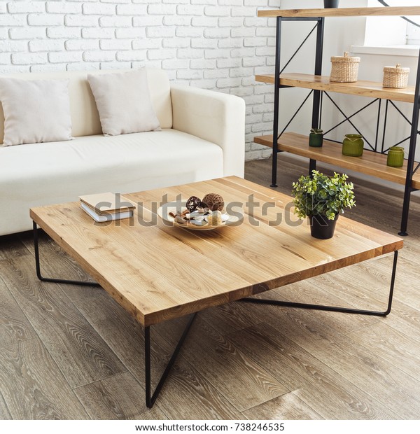 modern wooden table in\
the loft interior