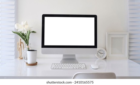 Modern workplace with computer pc, books, alarm clock and coffee cup on white table. - Powered by Shutterstock