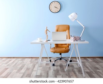 Modern workplace with office chair and laptop