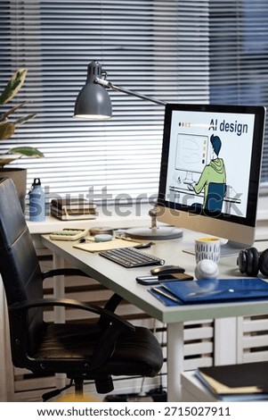 Modern workspace featuring desktop computer displaying AI design illustration, office chair positioned at desk, digital tablet, keyboard, headphones, coffee cup and notebooks visible