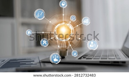 A modern workspace featuring a light bulb representing innovation, connected to various digital icons symbolizing business strategies and productivity tools. Crux