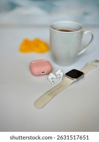 Modern workspace flat lay with tech accessories and hot drink on white background