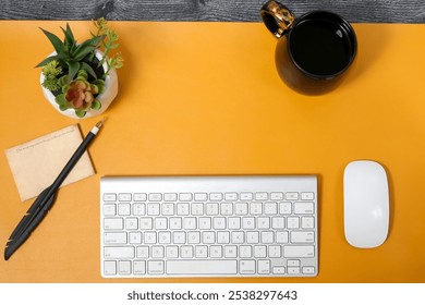 Modern Workspace with Keyboard, Mouse, Coffee Mug, Pen, and Succulent Plant on Bright Orange Desk