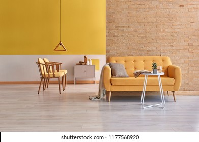 Modern Yellow Detail Living Room Concept Two Side Room With Yellow Wall And Brick Wall Decoration.
