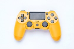 Modern Yellow Gamepad (joystick) On Gray Background. Top View
