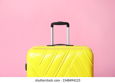 light pink suitcase