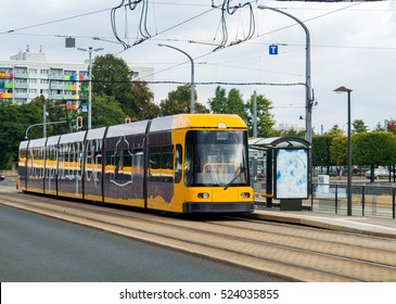 Modern yellow tram in Dresden in a beautiful cloudy autumn day in Dresden, Germany